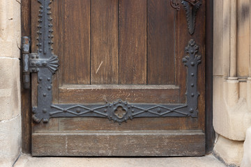 church brown wooden door with handles details