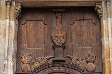 church brown wooden door with handles details