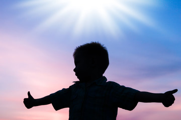 Happy children playing on nature summer silhouette