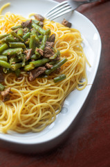 Large White Plate with Hot Pasta with Meat and Green Beans, Top View