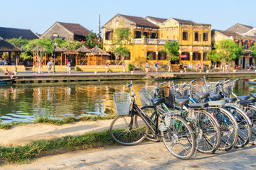 Bicycles parked beside the Thu Bon River. Hoi An, Vietnam