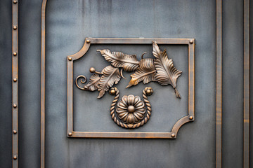 wrought-iron gates, ornamental forging, forged elements close-up