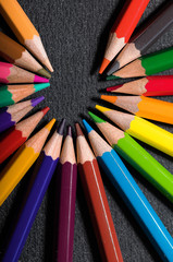 Multicolored and bright pencils. Lined out in a circl