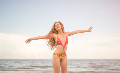 beautiful sexy woman in bikini swimsuit. freedom and relax in beach