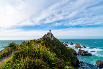 Nugget Point, Rocks cliffs, and beautiful ocean. A path to Lighthouse. The Catlins, New Zealand.