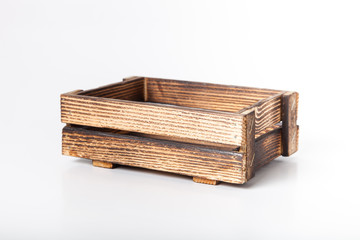 Handmade burned wooden box on a light background