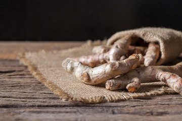 Turmeric on wooden background