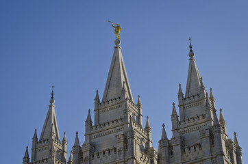 Fototapeta na wymiar A view of golden moroni on the salt lake city temple in the evening summer sun. 