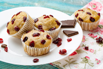 Muffins with cherry on a blue background, horizontal