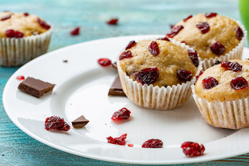Muffins with cherry on a blue background, horizontal