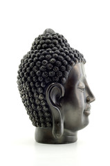 Portrait of a Buddha statue isolated on white background