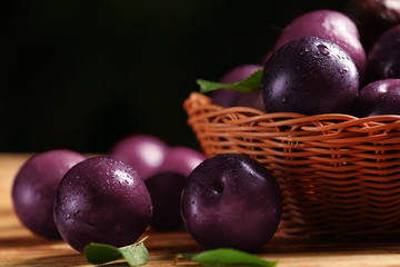 Ripe juicy plums on table © Africa Studio