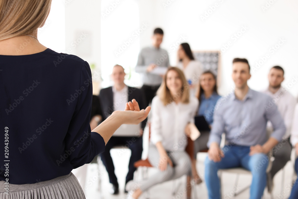 Canvas Prints Female business trainer giving lecture in office