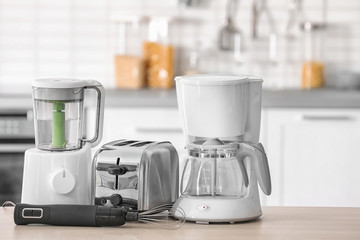 Kitchen appliances on table against blurred background