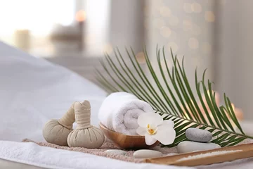 Rolgordijnen Beautiful spa composition on massage table in wellness center © New Africa