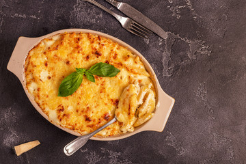 Mac and cheese, american style macaroni pasta in cheesy sauce.