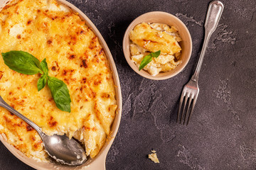 Mac and cheese, american style macaroni pasta in cheesy sauce.