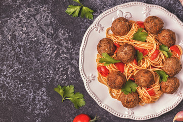 Roasted  meatballs with spaghetti.