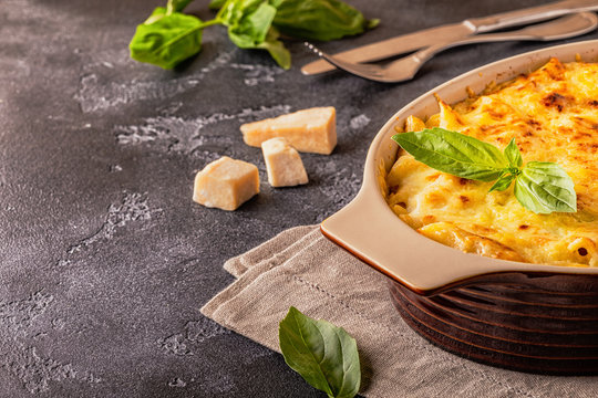 Mac and cheese, american style macaroni pasta in cheesy sauce.