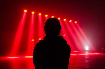 Silhouette over disco lights