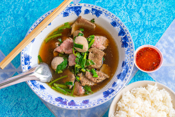 Beef noodles with braised beef and meatball delicious Chinese style Asian favorite Thai street food.