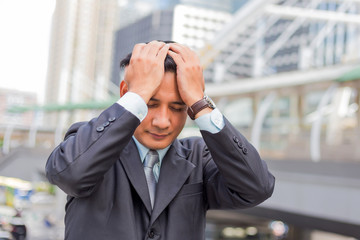 Business man tired or stressed after his work. Image of Stressed businessman concept.