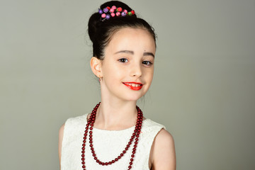 Fashion and beauty, pinup style, childhood. Little girl in vintage dress, prom. Child girl in stylish glamour elegant dress. Retro girl or fashion model, beauty. Retro look, hairdresser, makeup