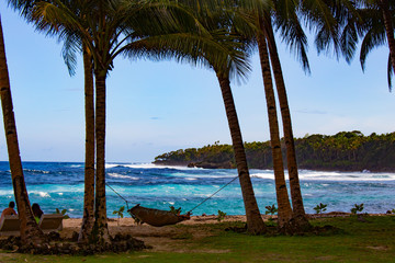 Siargao, PHILIPPINES - Feb 15, 2018: people rest on the beach of the island.