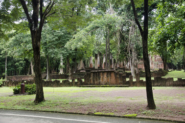 View landscape of buddha statue at Wat Phra Non in ancient building and ruins city of Kamphaeng Phet Historical Park