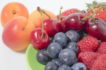 Naklejka na ściany i meble Fruit composition, blueberries, raspberries, cherries, strawberries and apricot