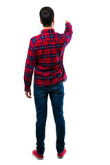 Naklejka premium Handsome man pointing back with the index finger
