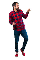 Naklejka premium Handsome man listening to the music and dancing