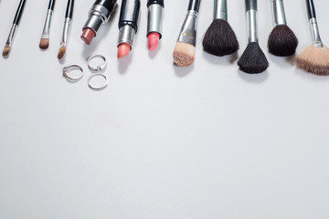 Womans accessories and cosmetics flatlay on white background. Top view. Copy space