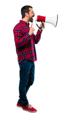 Handsome man shouting through a megaphone