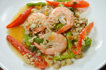 spicy stir fried minced pork and shrimp with basil leaf on plate