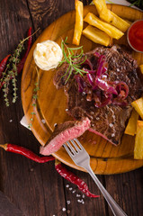 Beef steak with homemade french fries, beer and tartar sauce