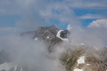 Fototapeta premium top of säntis mountain in switzerland, clouds and blue sky