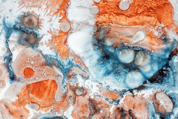 Abstract painting, can be used as a trendy background for wallpapers, posters, cards, invitations, websites. Modern artwork. Marble effect painting. Mixed blue, orange and white paints.