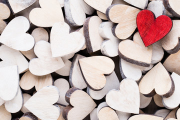 Background with wooden hearts, place for text.
