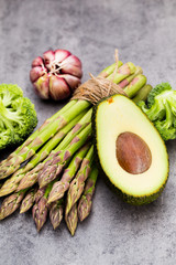 Bunch of fresh asparagus on wooden table.