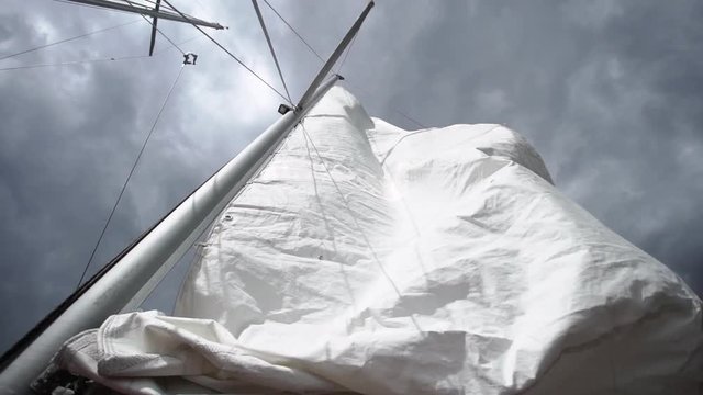 Sail on sailing yacht at windy sunny day