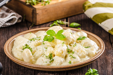 Cheese gnocchi with blue cheese sauce and galic