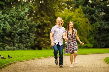 Fototapeta premium Happy couple playing in park