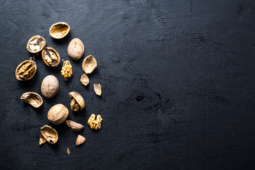 Dry nuts on black background. Copy space