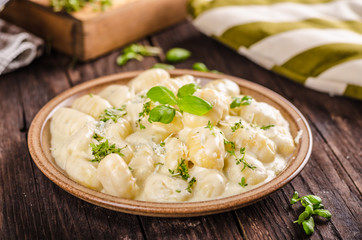 Cheese gnocchi with blue cheese sauce and galic