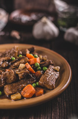 Pork medallions with vegetable and soy garlic sauce