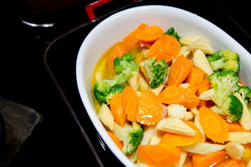 Stir Fried Vegetables with carrot,Block Kerry in white bowl, food background.