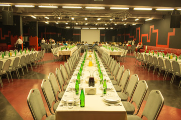 banquet hall in co working space with people back to camera before conference  