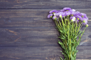 bouquet of summer flowers on a wooden background
