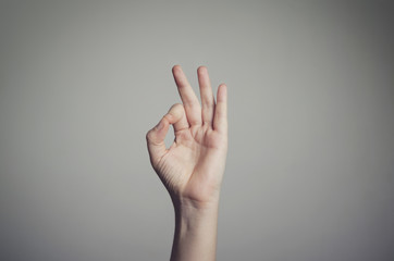 Man's hand showing an OK sign